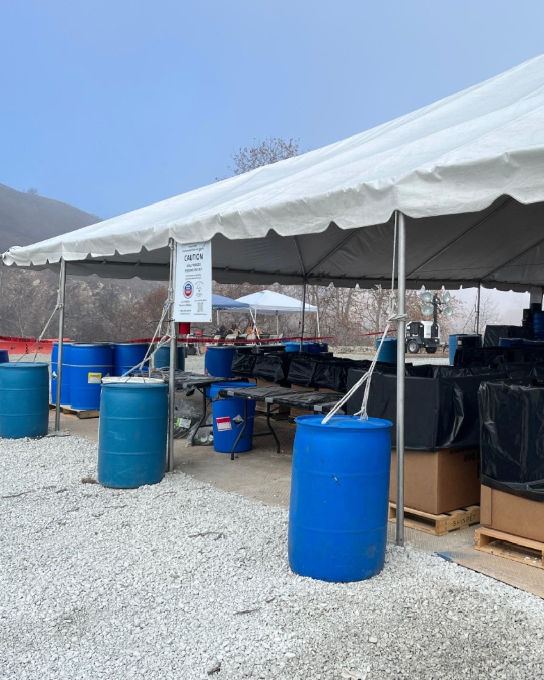 EPA sorting site under a white tent.